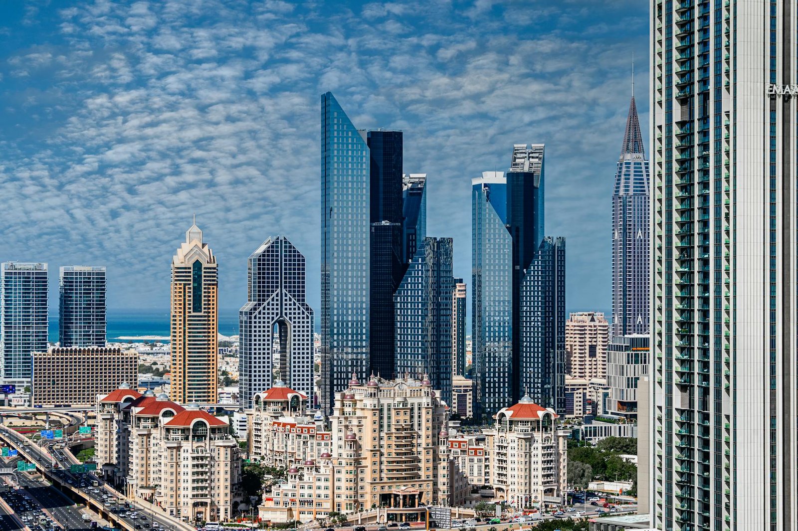 Stunning view of Dubai's iconic skyline showcasing modern skyscrapers under a blue sky.