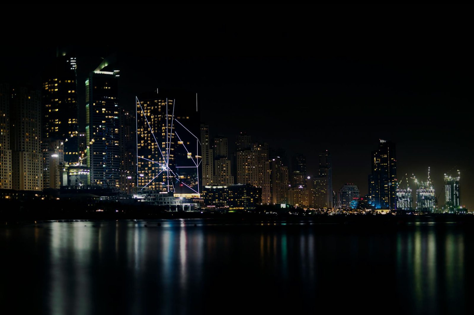 Captivating night view of Dubai's skyline reflecting on the water