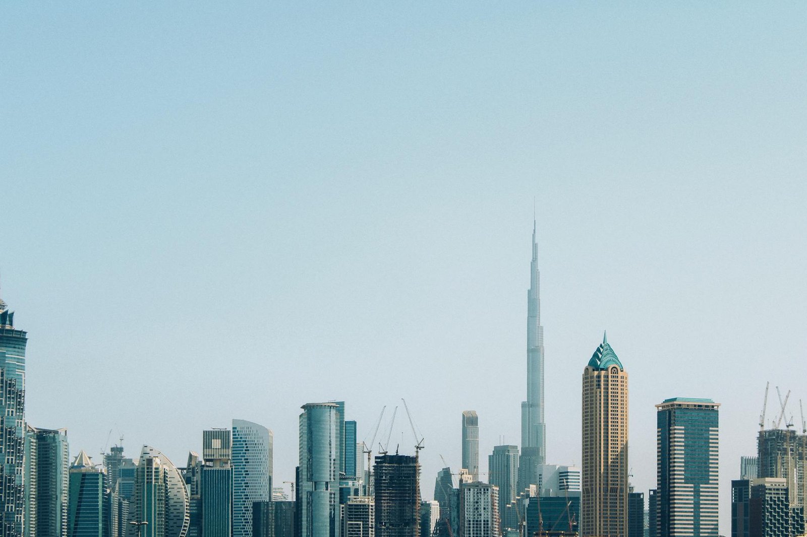 A stunning view of Dubai's skyline with the Burj Khalifa towering above modern skyscrapers.