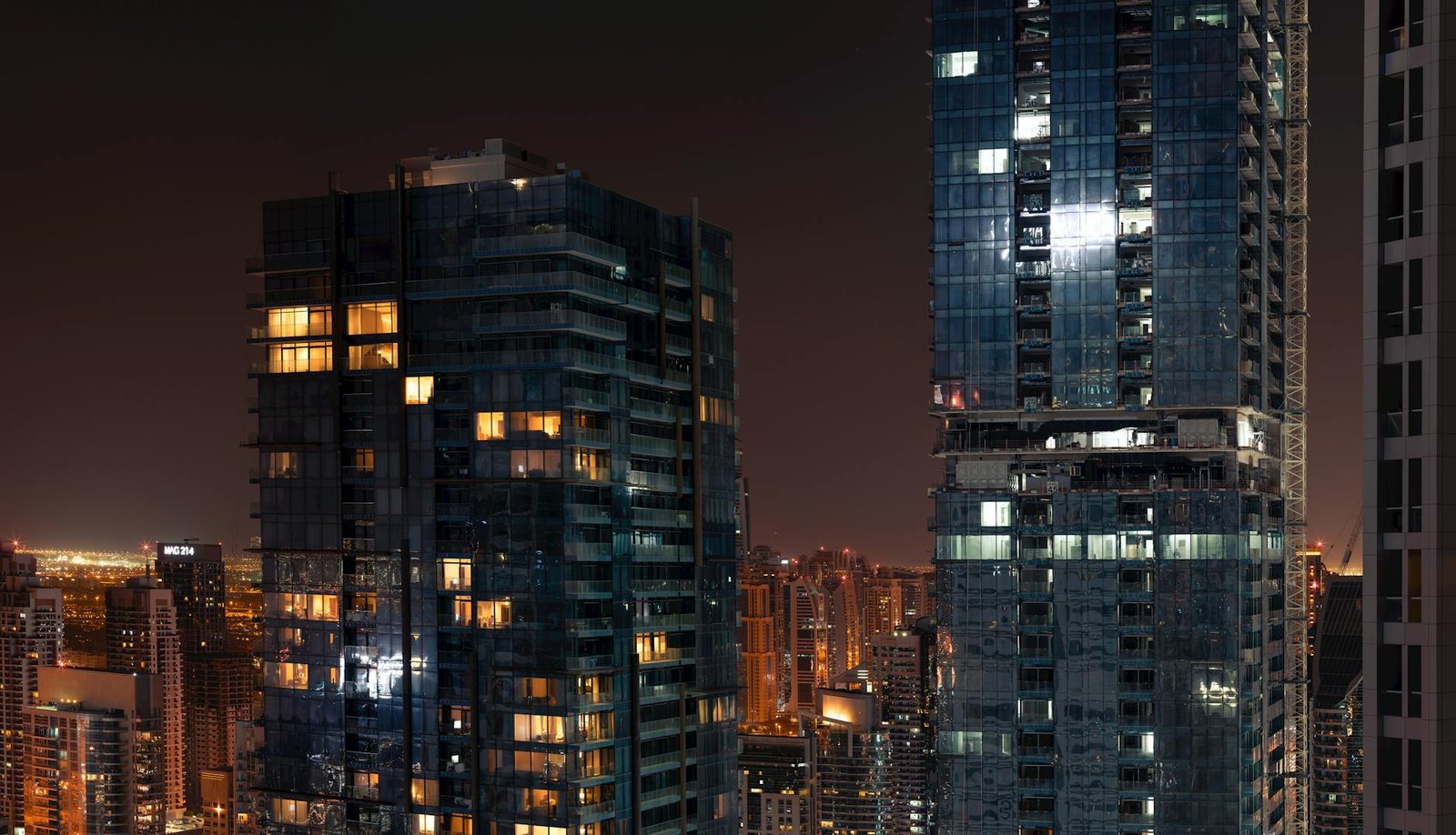 Spectacular view of Dubai's skyline featuring illuminated skyscrapers at night.