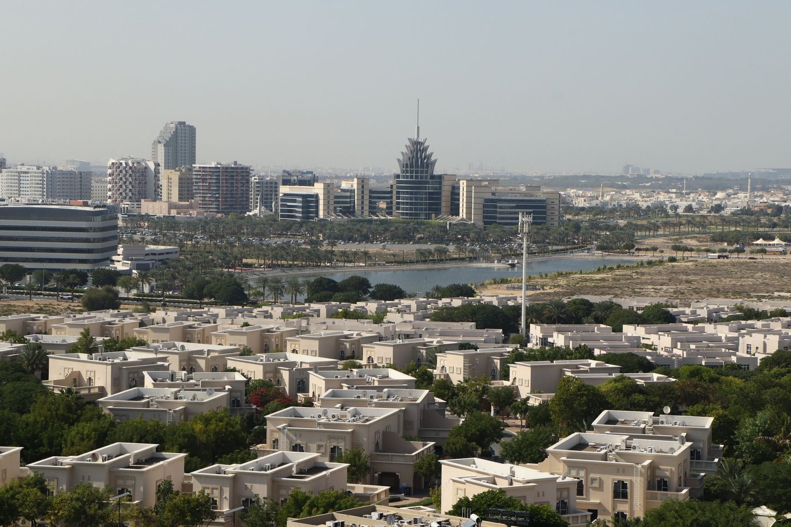 A scenic aerial view of Dubai Silicon Oasis with modern architecture and lush greenery.